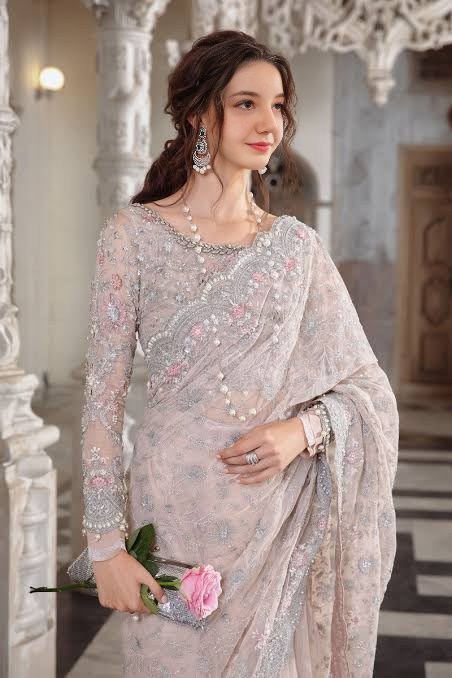 Sana Yousaf wearing pale pink beaded saree
